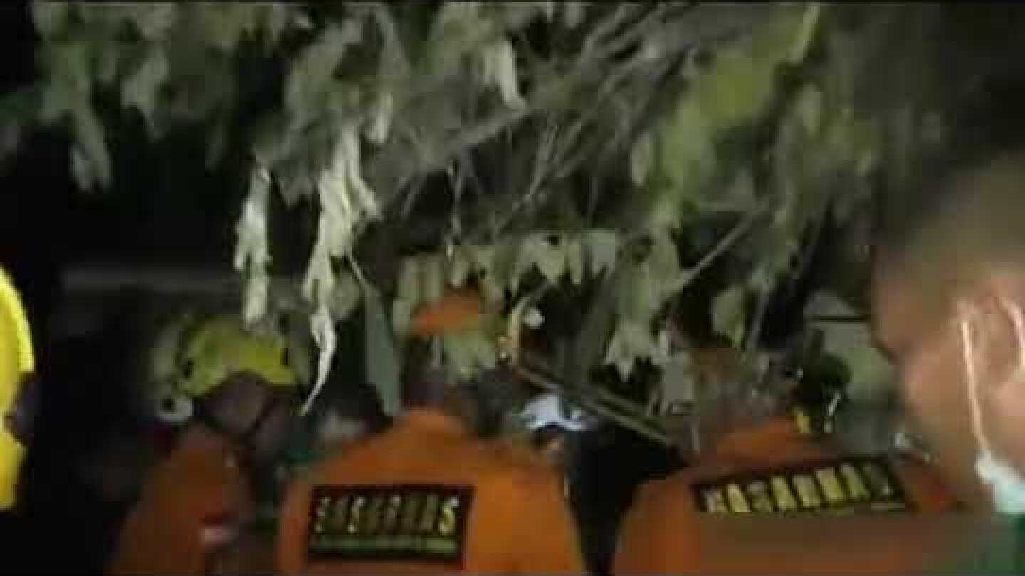 Woman pulled from rubble in Indonesia quake zone