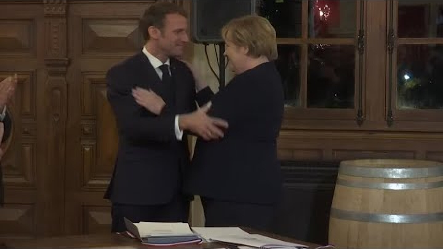 French President Emmanuel Macron raises final toast to Angela Merkel