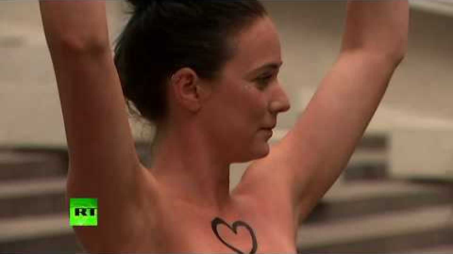 Topless women demonstrate in support of Saudi teen who fled her family