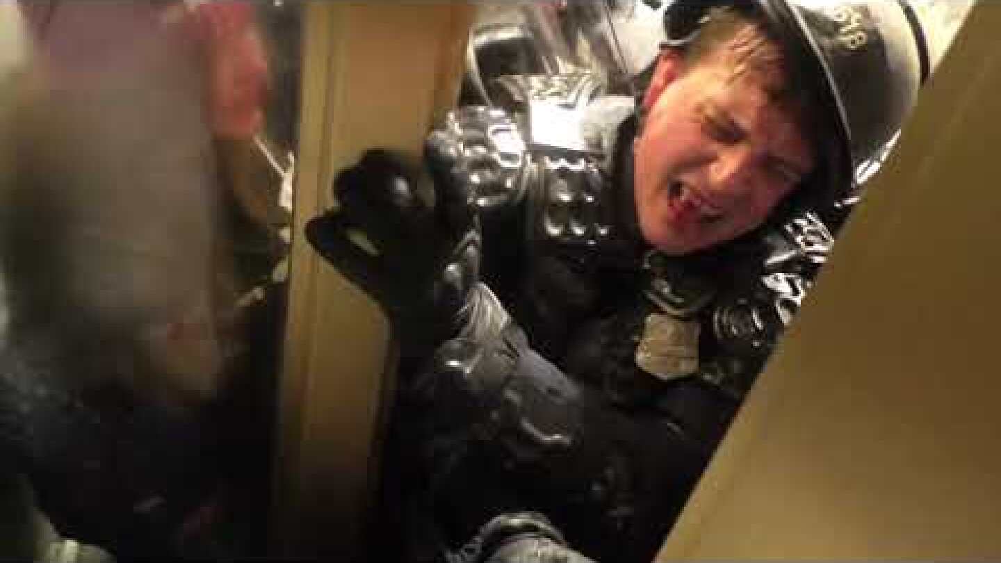 Police Officer Crushed in Door During US Capitol Insurrection
