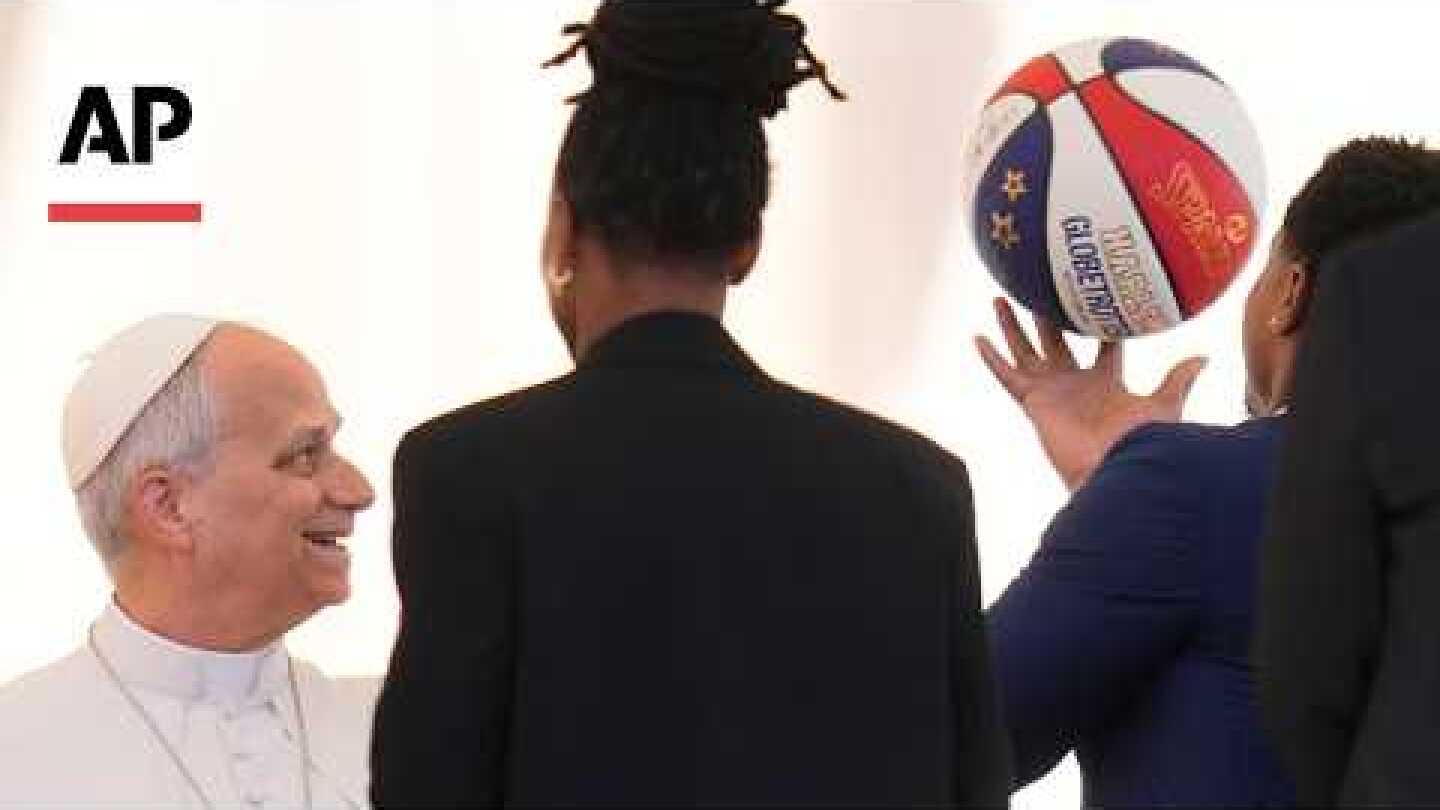 Harlem Globetrotters teach Pope Leo XIV how to spin basketball on his finger