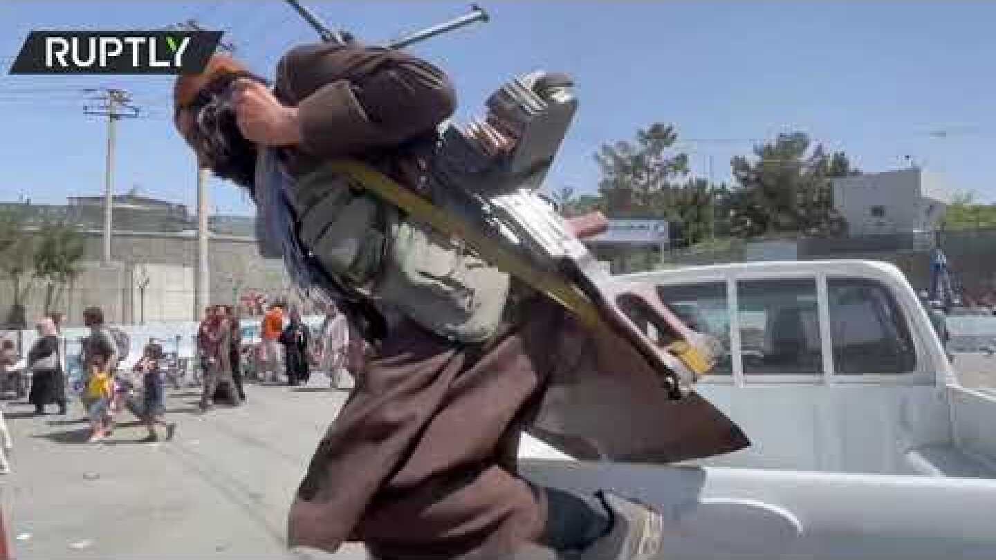 Families Storm Hamid Karzai International Airport amid Taliban soldiers shooting in the air