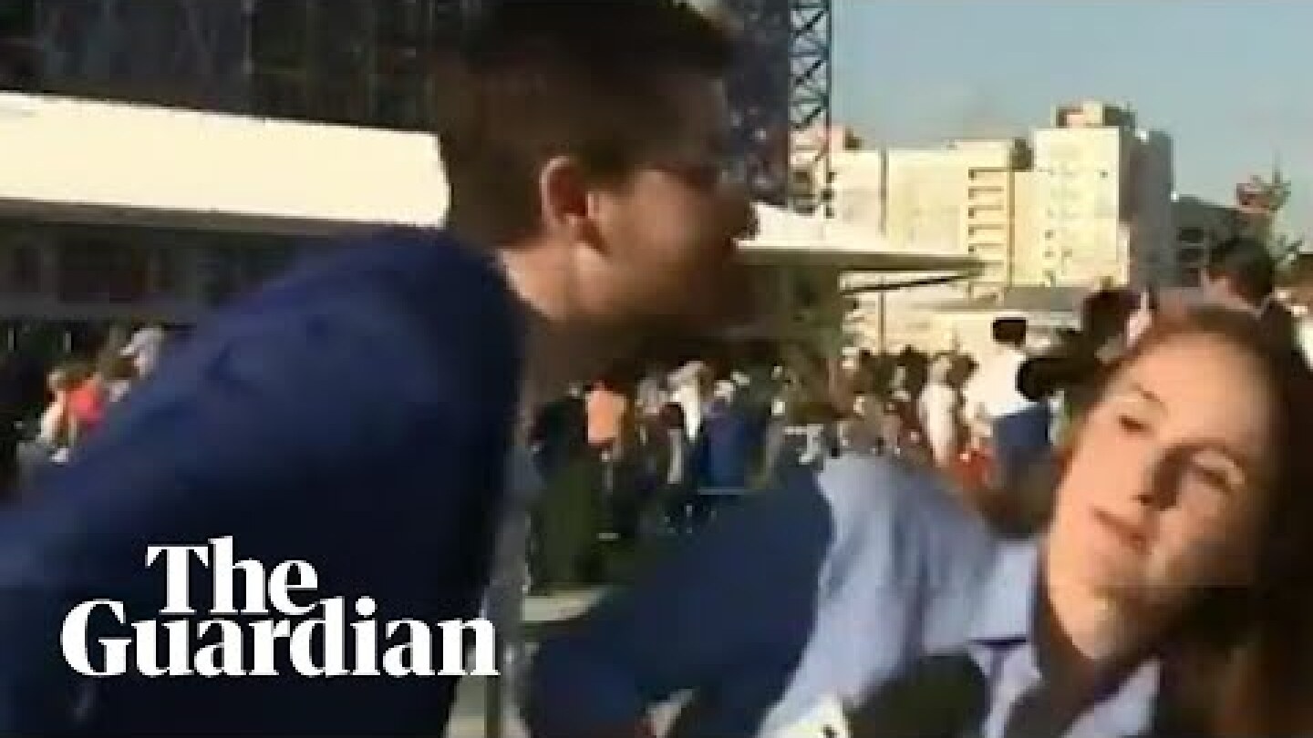 Journalist tells off fan who tries to kiss her during World Cup report