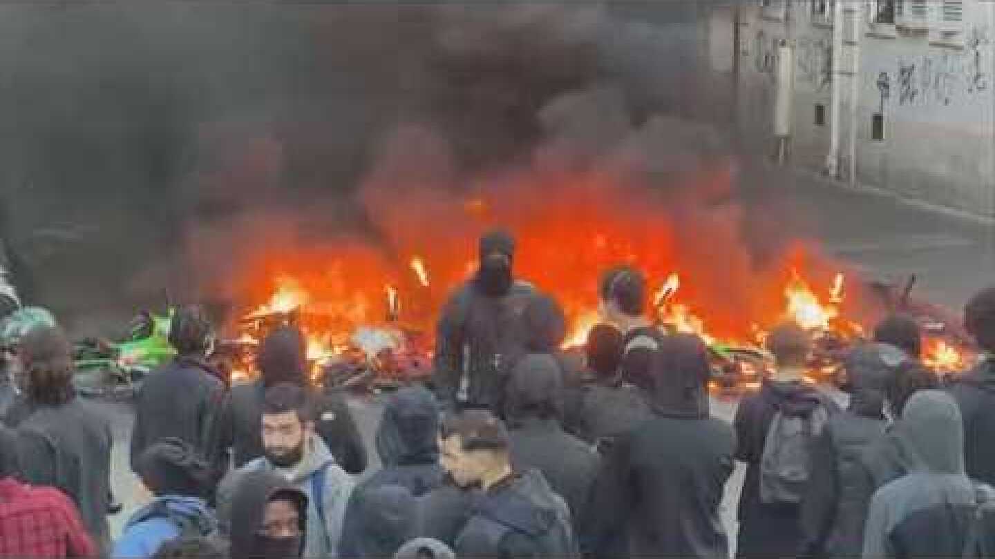 France institutes curfew after violent riots