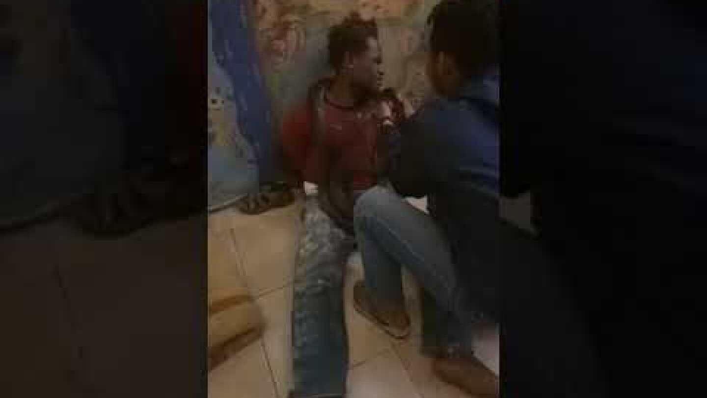 Colonial Indonesian police uses snake to interrogate a young West Papuan man