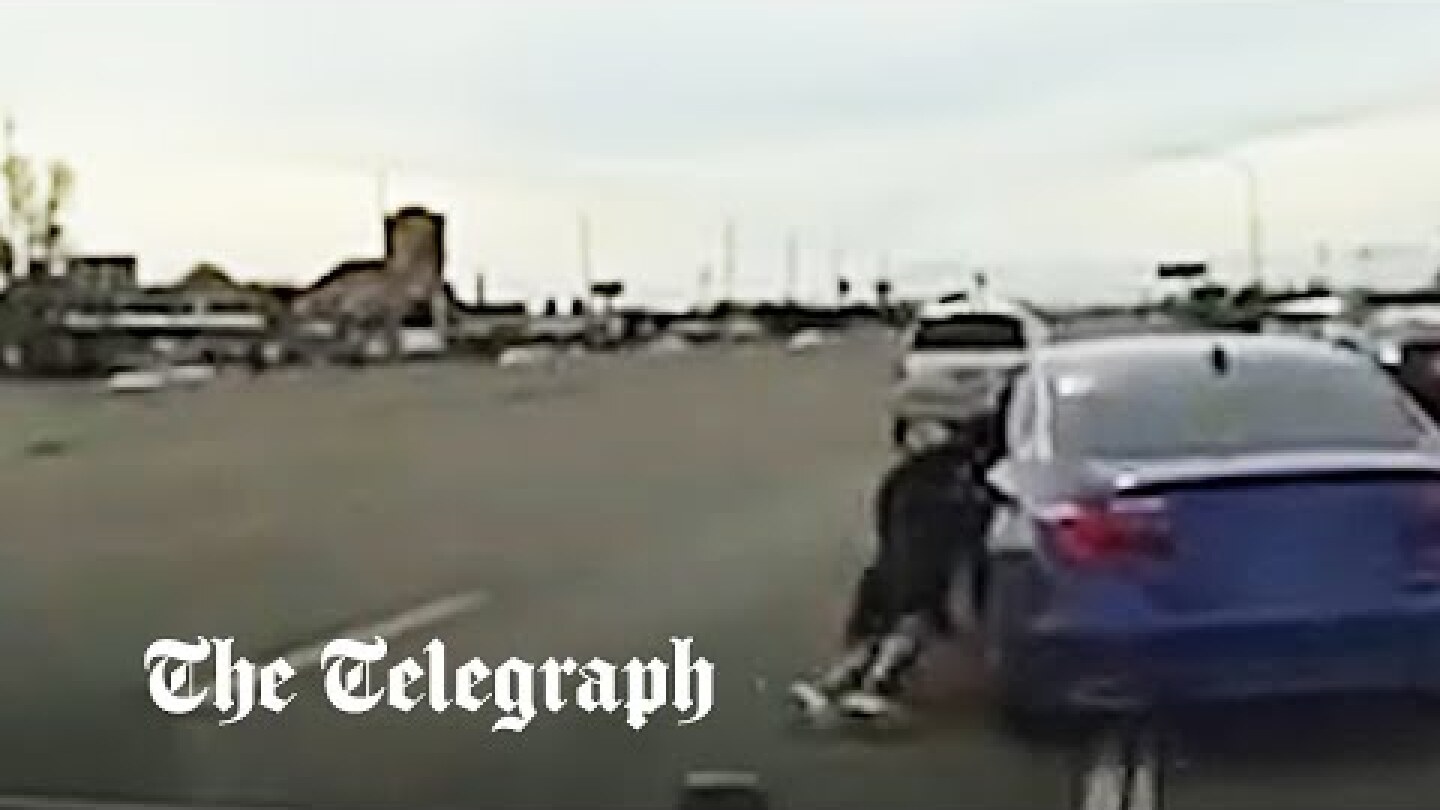 Fleeing suspect clings to moving car as high speed chase goes wrong