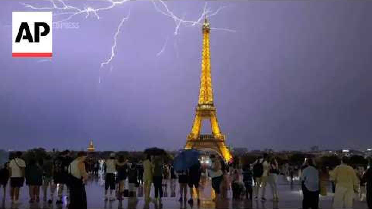 Lightning strikes the Eiffel Tower as a thunderstorm rages over Paris