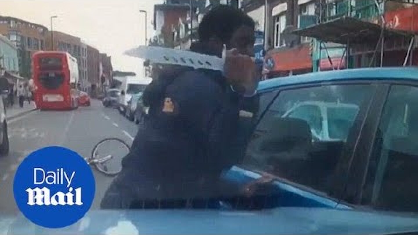 Shocking moment cyclist pulls knife on driver in fit of road rage