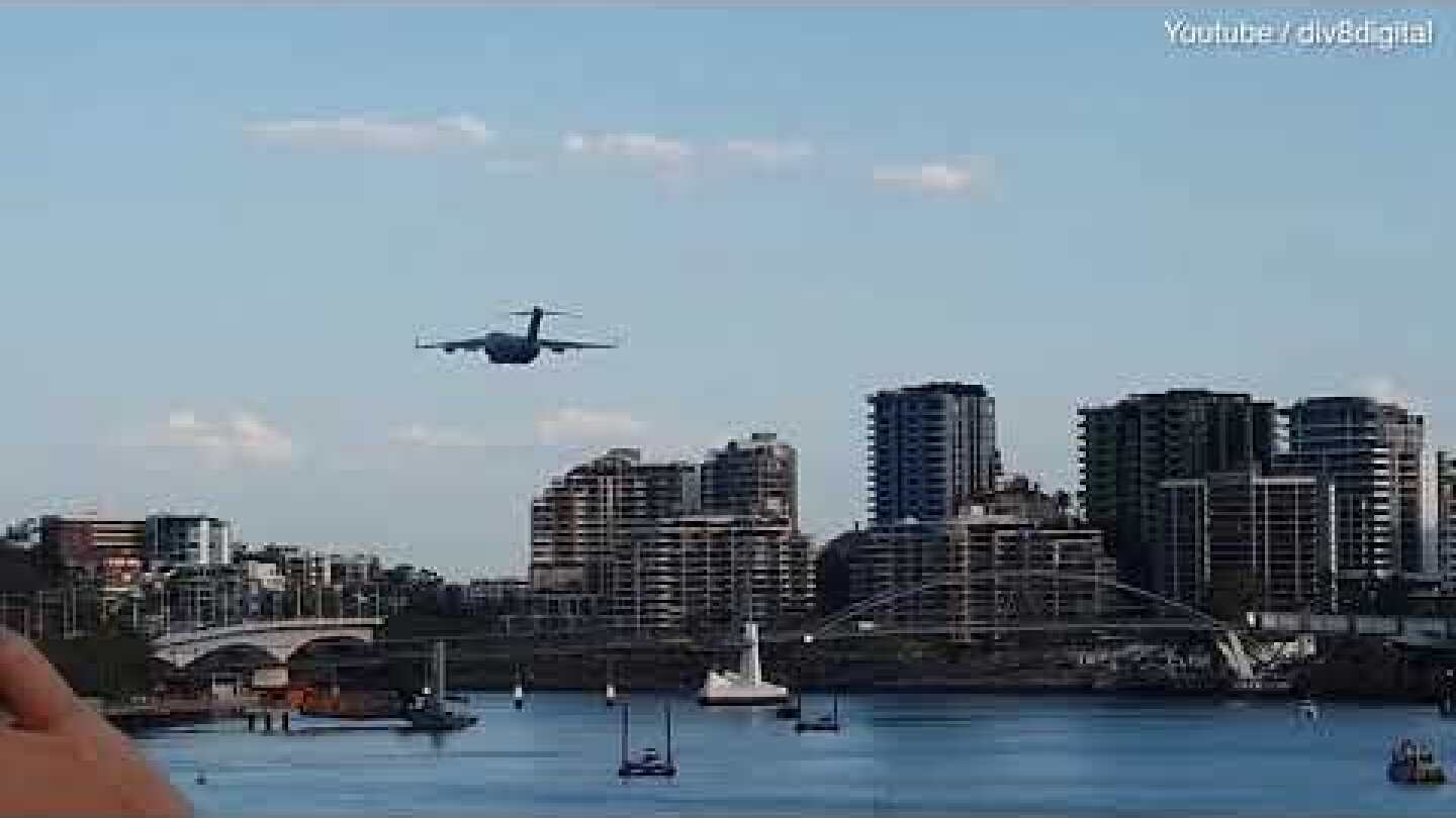 Video: Moment huge cargo plane flies over spectators at airshow