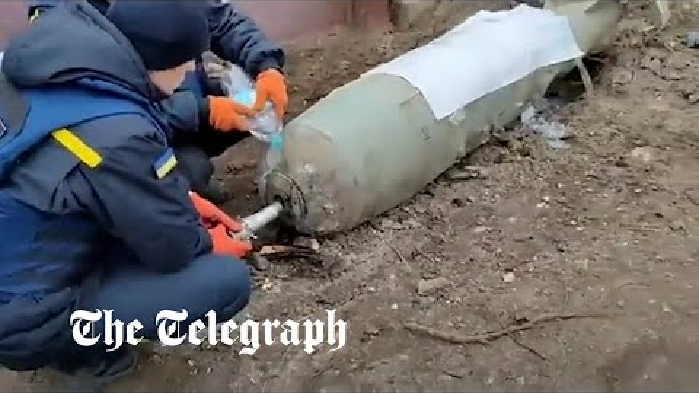 Ukrainians defuse giant Russian bomb with two hands and bottle of water