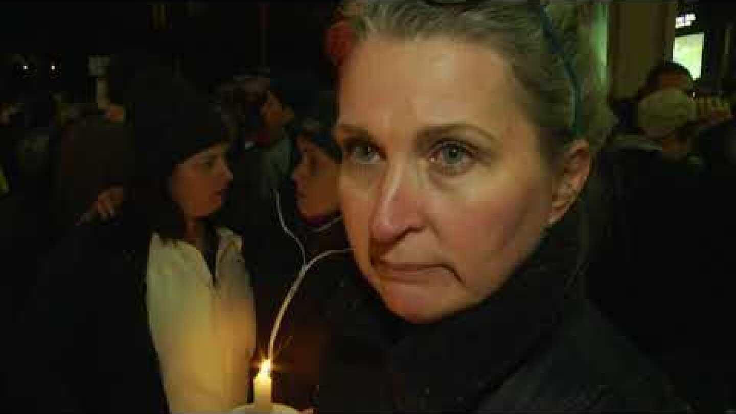 Thousands filled with grief at PA shooting vigil