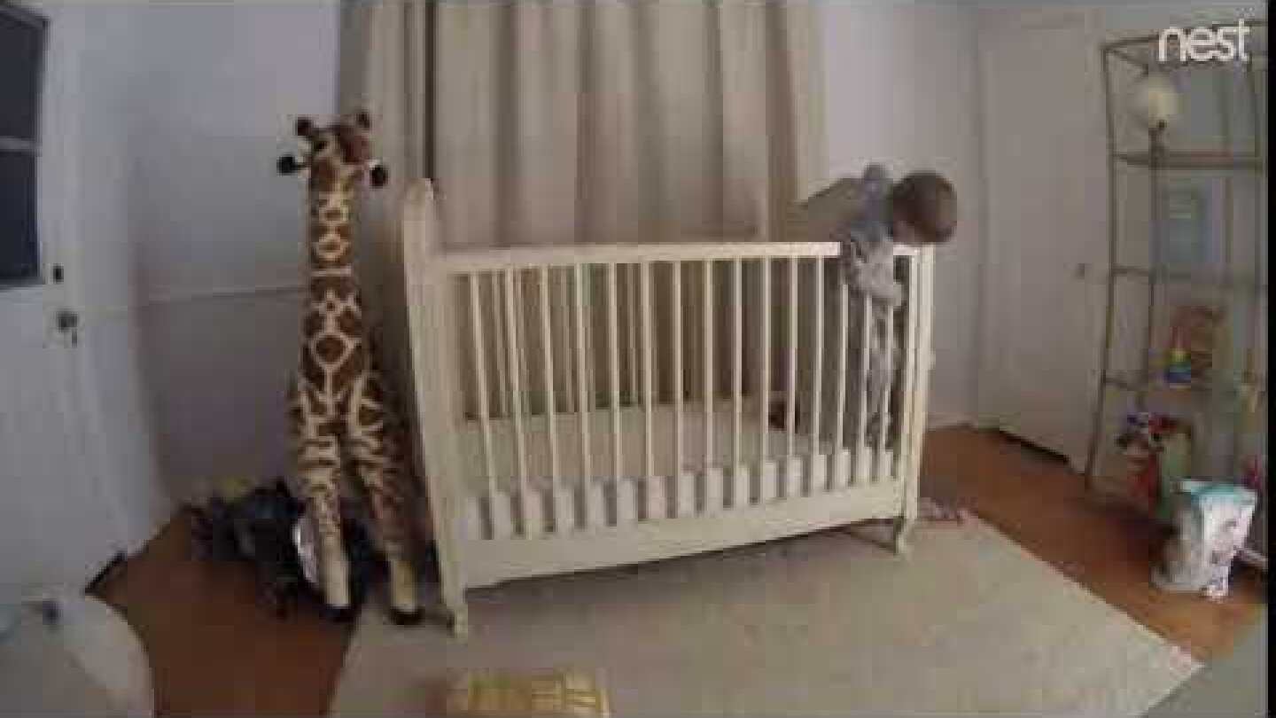 Dad Saves Son from Tumbling Head First out of Crib - 1001849
