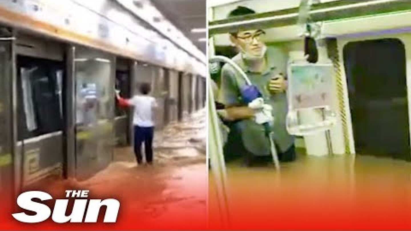 Terrified commuters risk drowning on subway as flood waters rise to shoulder level in China floods