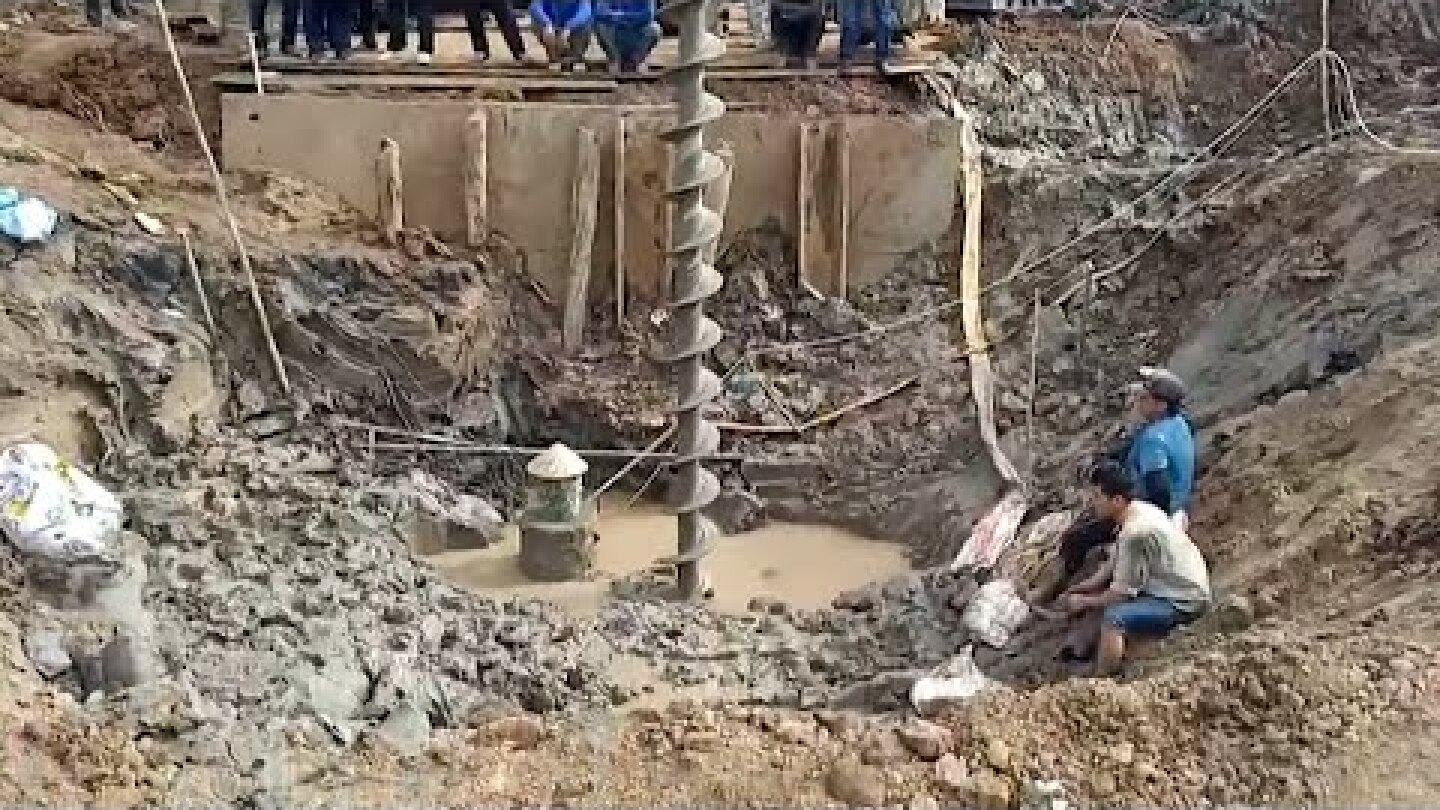 Vietnam rescuers attempt to save boy from 35 metre deep hole