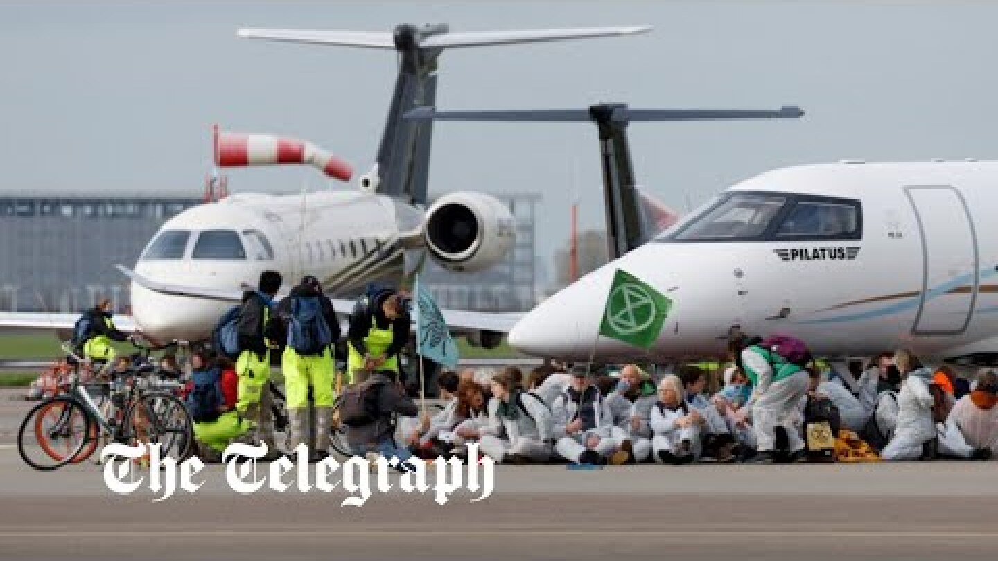 Climate activists block private jet take-offs at Amsterdam's Schiphol Airport