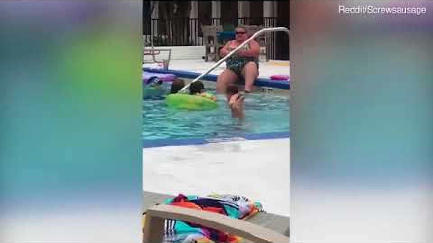 Shameless woman runs a razor over her legs in a busy hotel swimming pool in Florida.