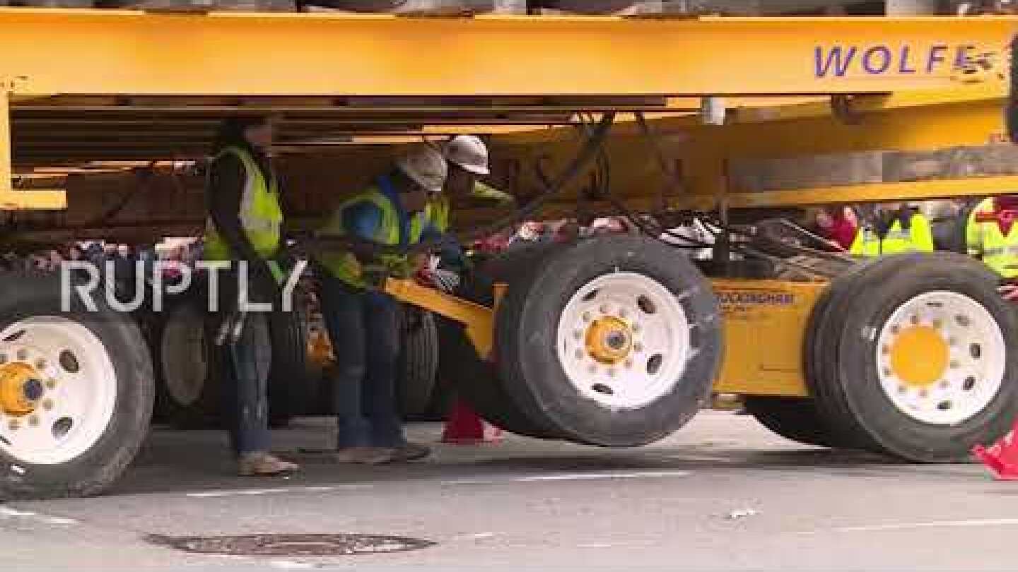 Ready to roll! Synagogue in Washington arrives on wheels to its new home