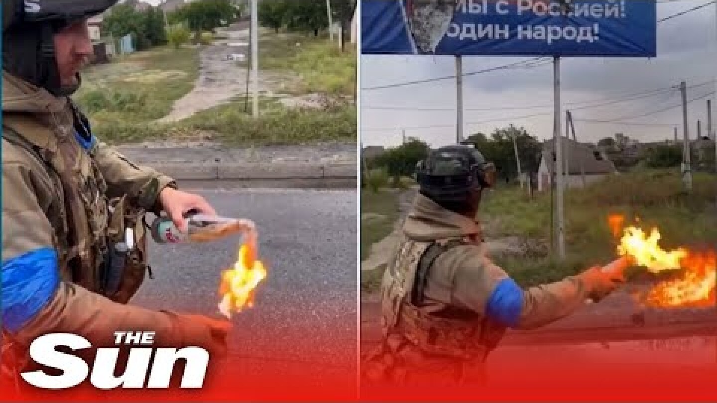 Ukrainian Soldier sets fire to Russian billboard with MOLOTOV COCKTAILS near Kharkiv