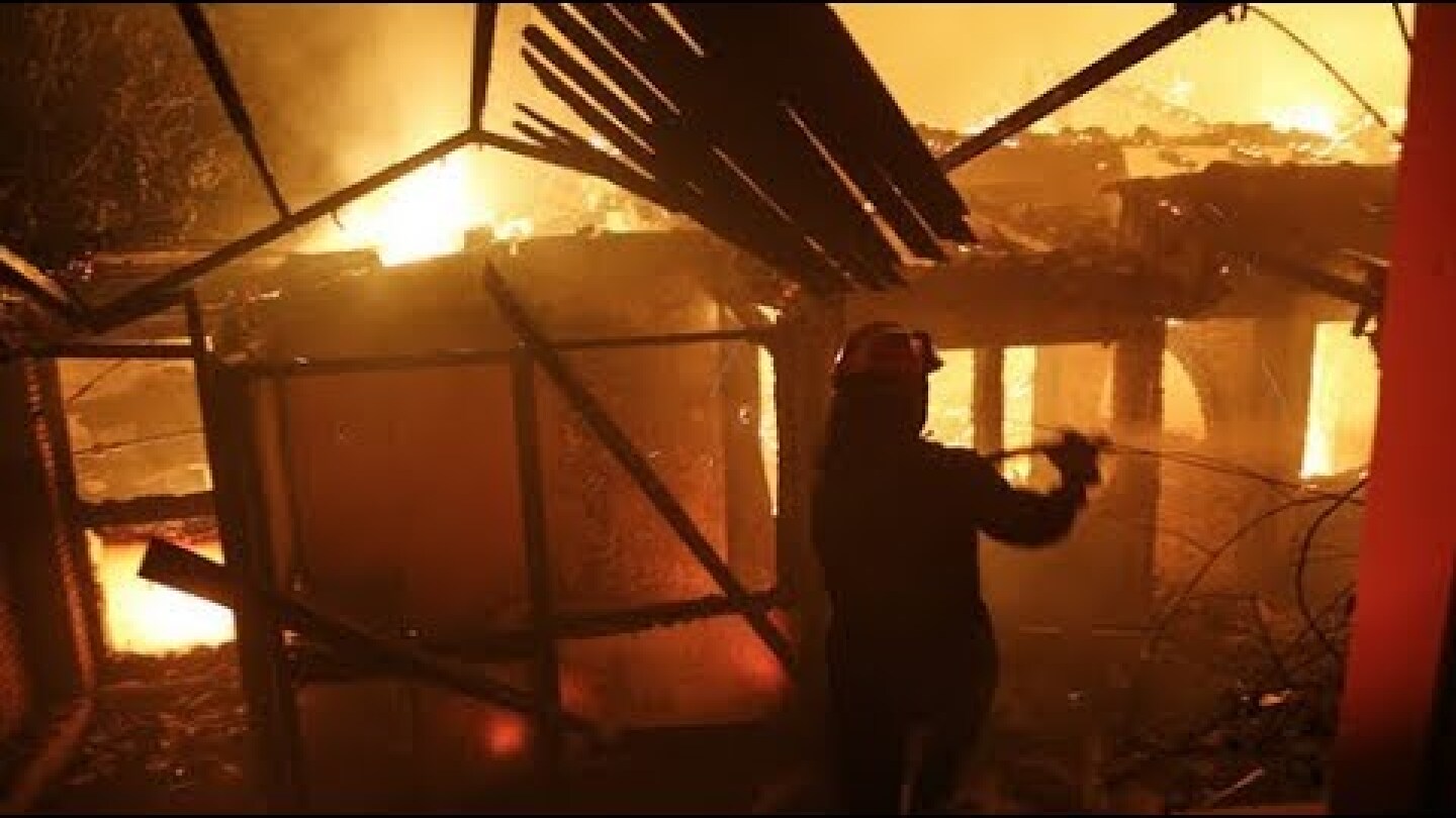 Wildfires rage across Greece as tourists flee