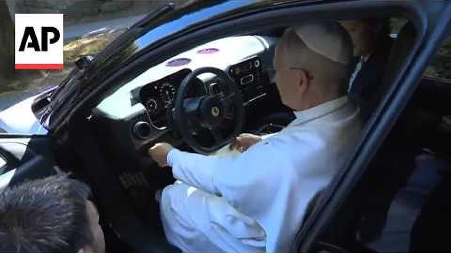 Pope Leo XIV sits in Ferrari's first fully electric car