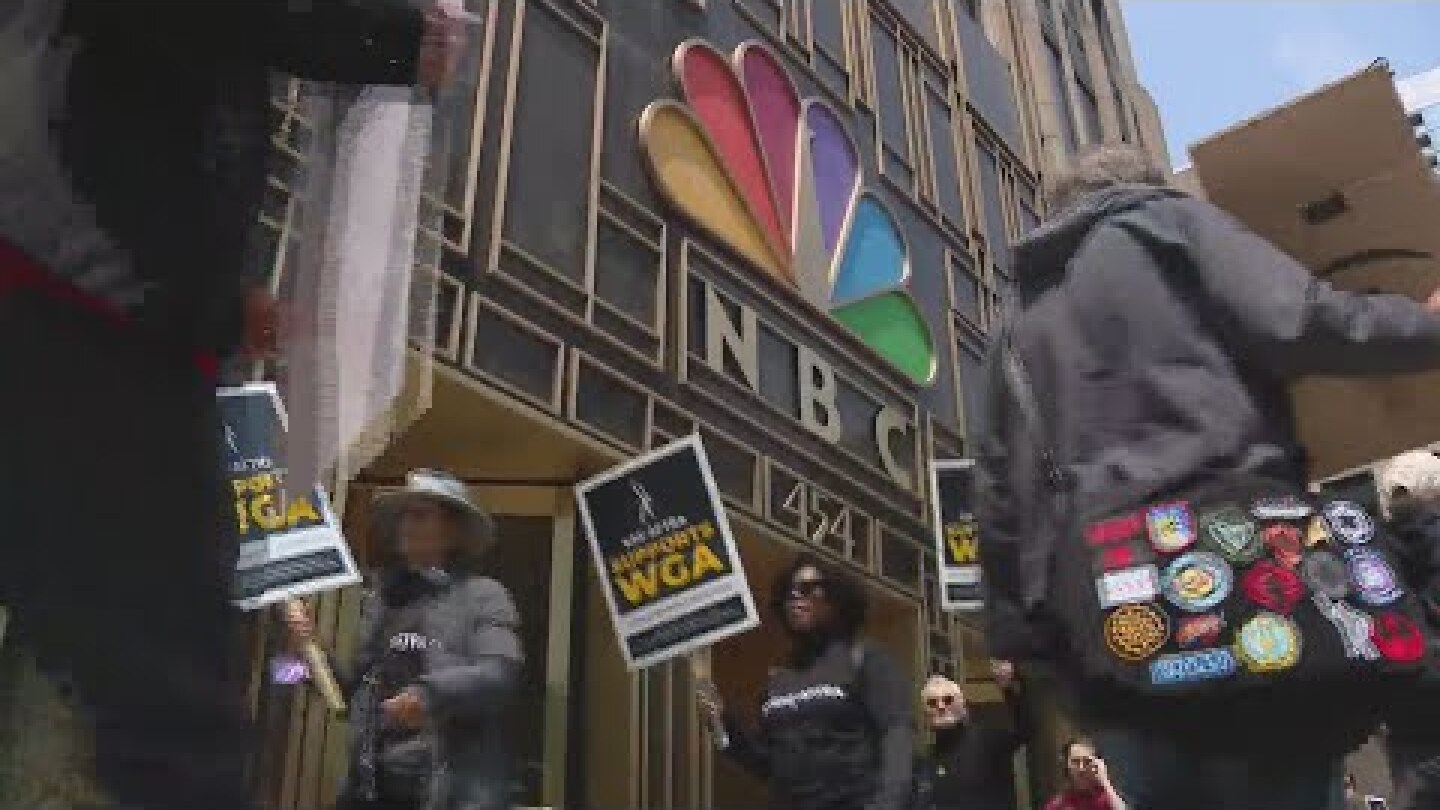 Television writers strike in front of NBC Tower in the Loop