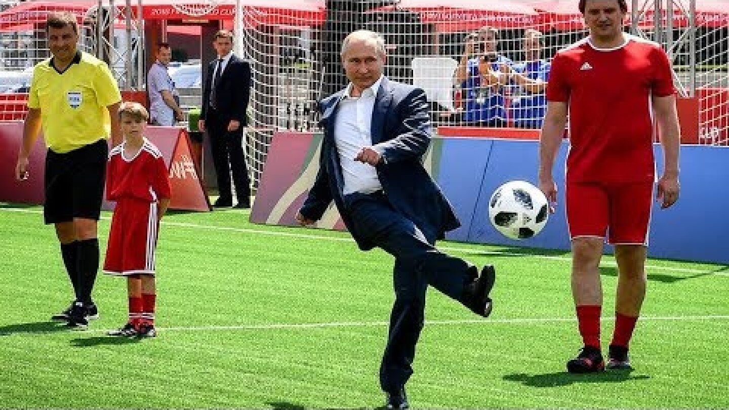 Putin it in the back of the net: Russian president has kickabout in Red Square