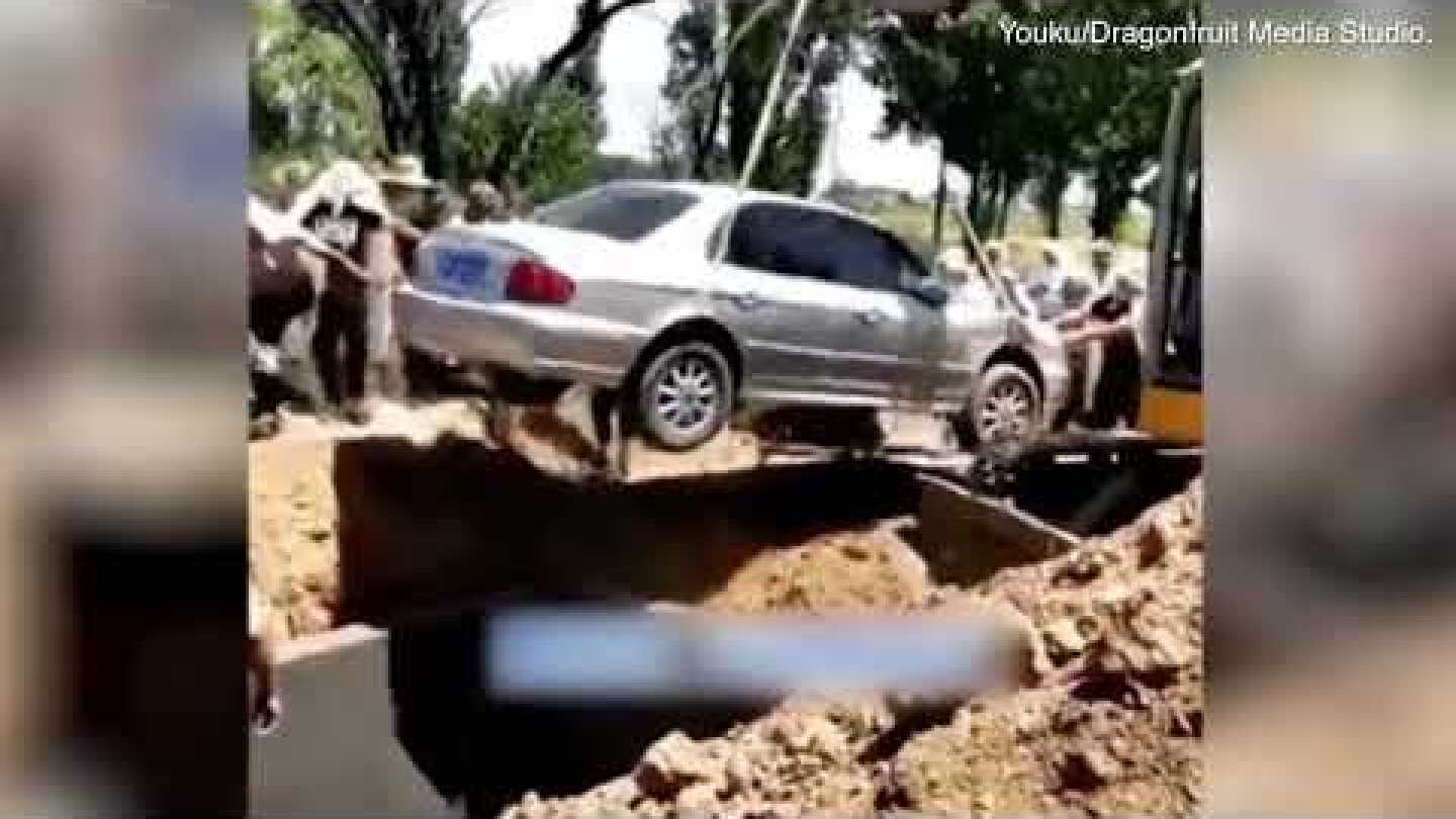 Bizarre moment a deceased man is buried in a car in China