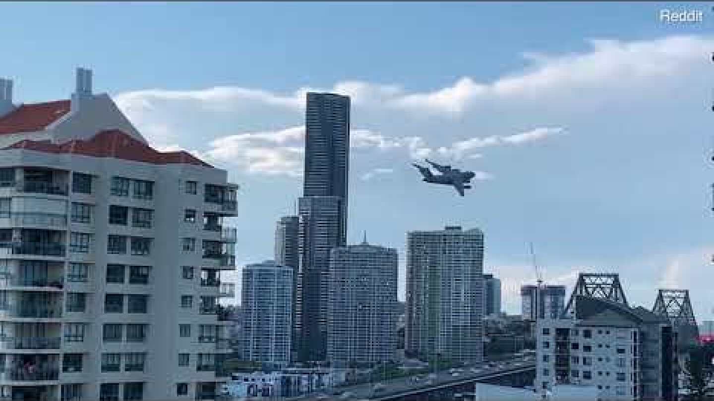 Video: Incredible moment plane narrowly avoids skyscrapers with stunt