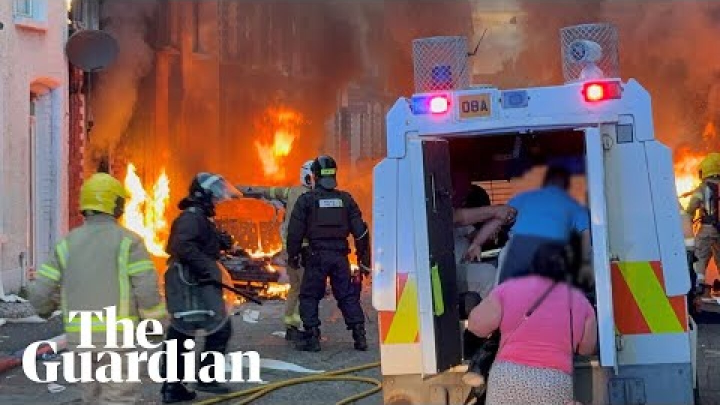 Belfast residents run from burning homes as violence erupts after protests