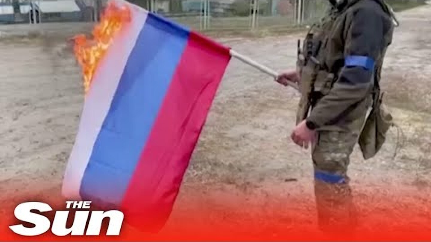 Ukrainian soldiers burn Russian flag in Vovchansk as they regain territory