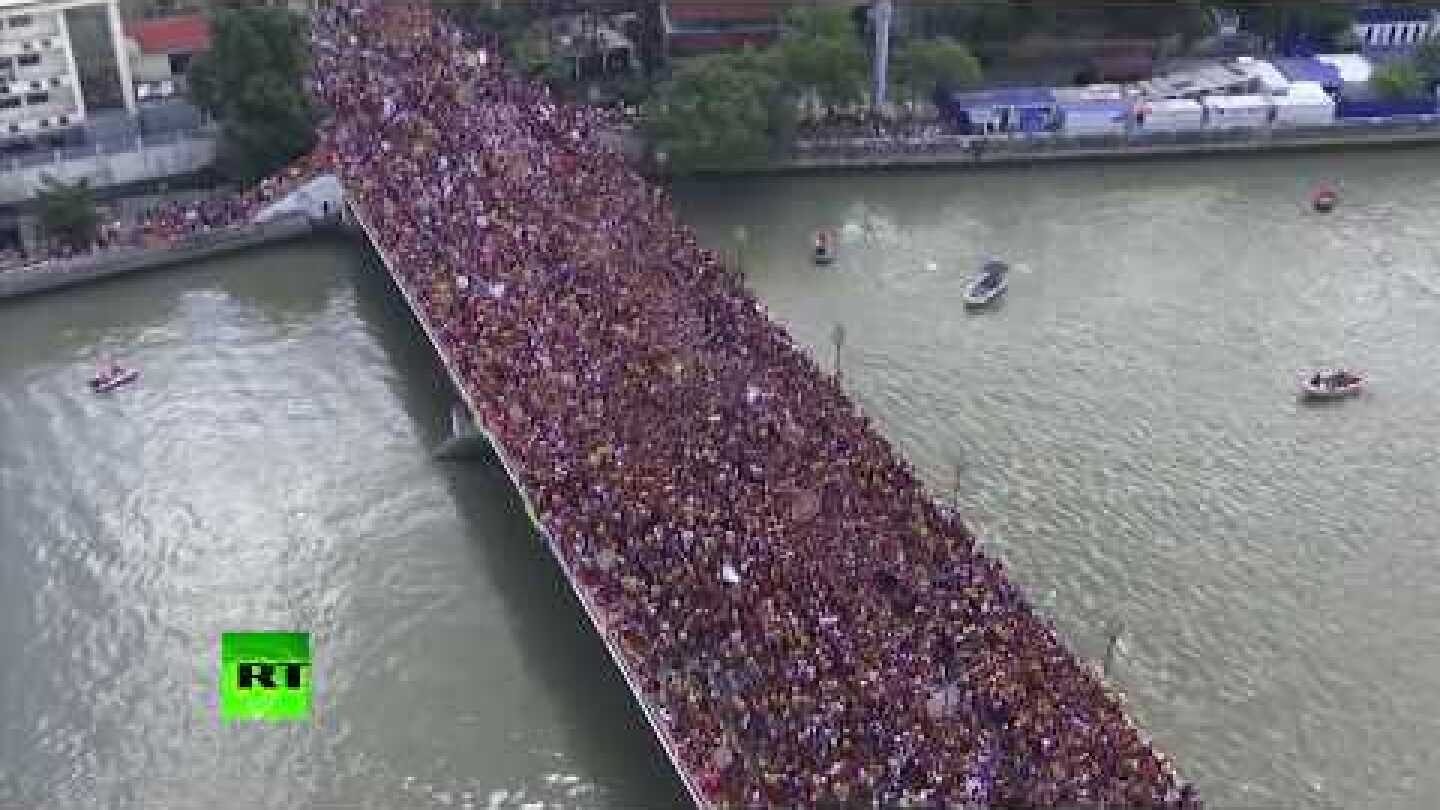 Thousands of devotees join massive Black Nazarene procession in the Philippines