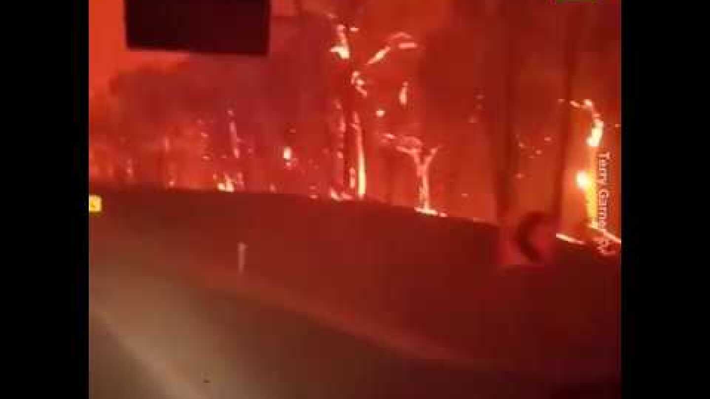 Firefighters drive through hellish landscape in Australia