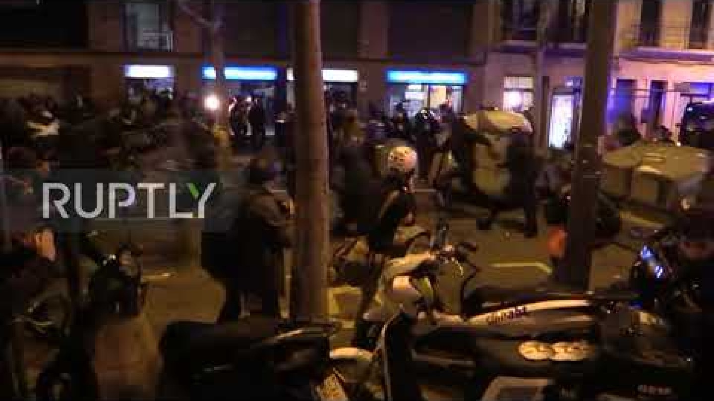 Spain: Police officer strikes protester with baton amid clashes outside Camp Nou