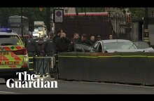 Westminster car crash: handcuffed man taken away by police