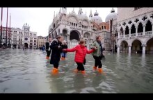 Woman's Luggage Floats Along Flooded Streets of Venice