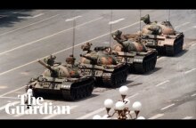 Tank Man: hero of 1989 Tiananmen protest stands in front of tanks – archive video