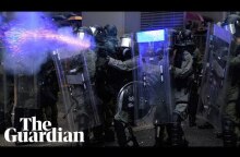 Police draw guns and deploy water cannon in clashes with Hong Kong protesters