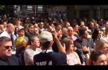 Manchester crowd joins in with woman singing Oasis after minute's silence - video