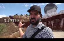 Mexico: Gigantic toddler peeks over Tecate border wall to see the other side