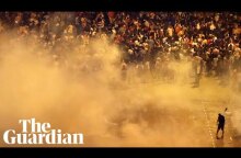 Police and football fans clash in Paris after France's World Cup victory