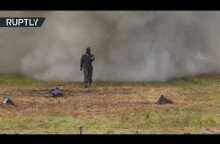 Russian Superwoman: Outrageous walk through explosions & fire to test armor suit