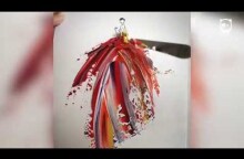 Artist uses paint and water drops to create spontaneous dress designs