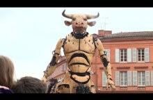 A minotaur and giant spider parade through Toulouse streets