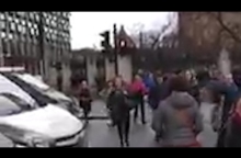 People flee parliament as gunshots ring out – video