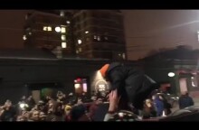 Moment Russian rapper Husky is arrested after impromptu gig on roof of car - video