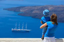 woman-holding-her-son-looking-at-the-sea.jpg