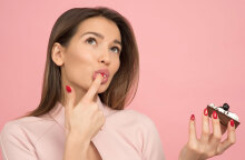 woman holding cake looking up