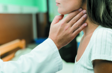 hand-touching-throat-patient