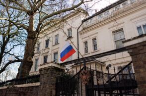 A half-mast flag is seen outside the Russian Embassy