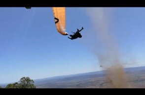 Dust devil sends paraglider flying